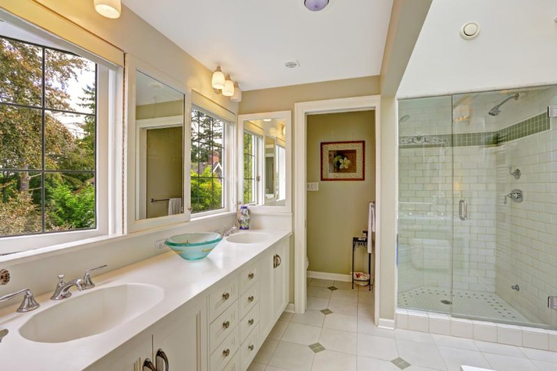 large master bathroom with tile floors, windows, and natural light